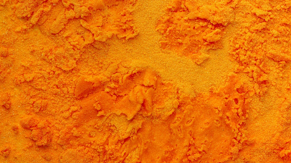 A close up of a yellow powdered substance